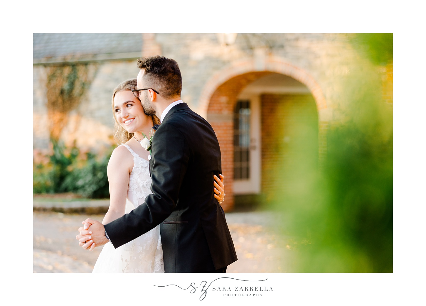 groom kisses bride's forehead while dancing outside Shepard's Run