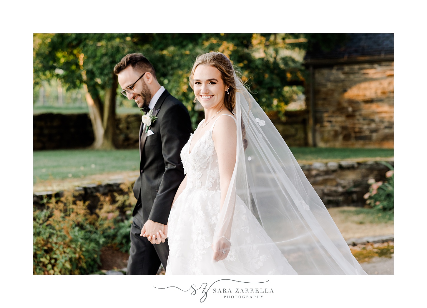 bride and groom hold hands walking through lawn at Shepard's Run