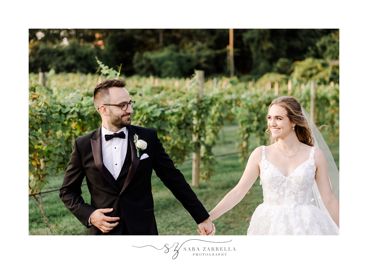bride and groom hold hands walking through vines at Shepard's Run