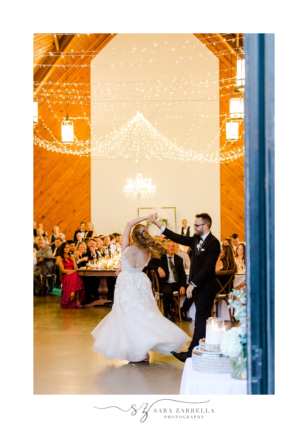 groom twirls bride during South Kingstown RI wedding reception