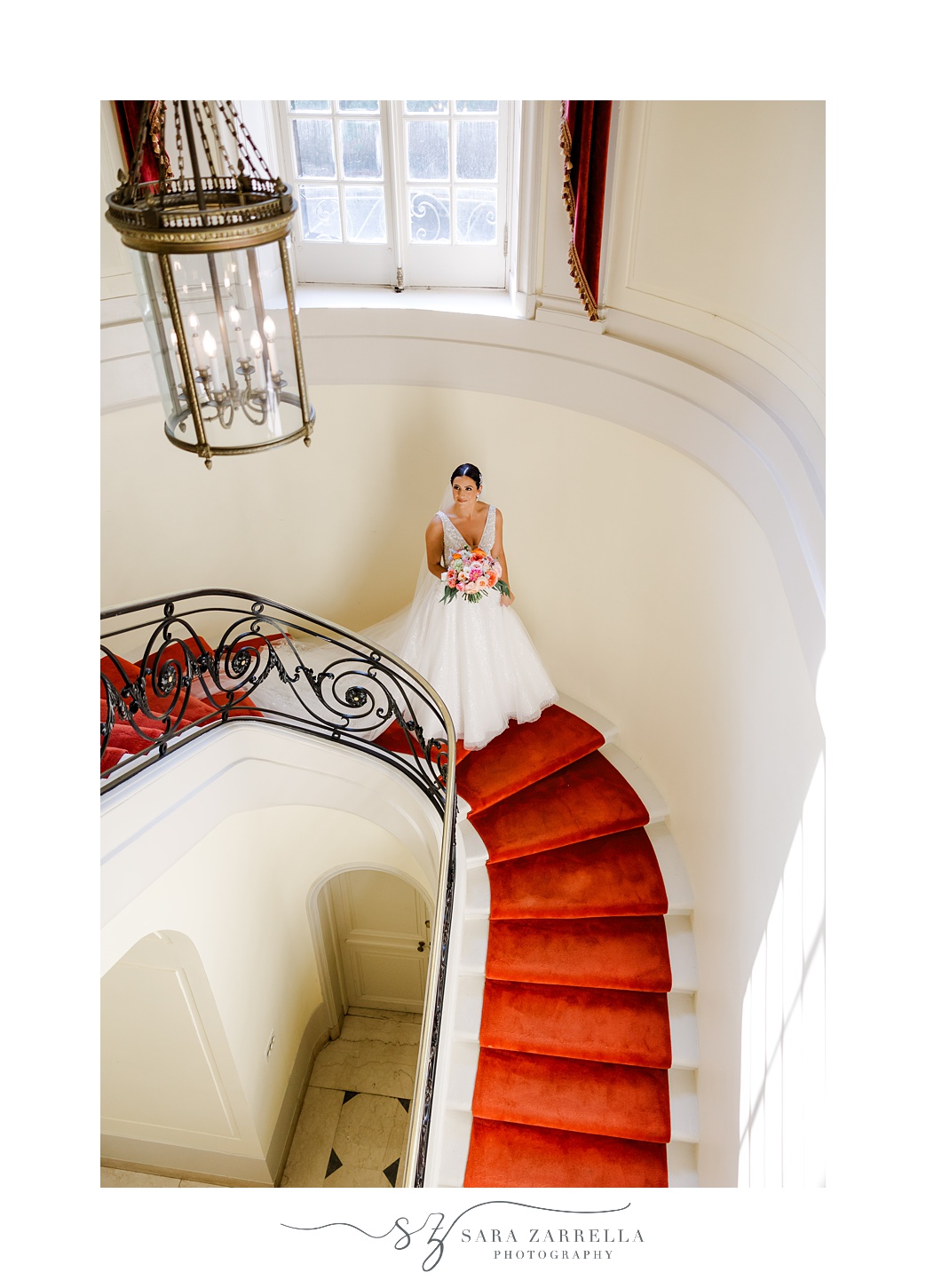 bride walks down staircase inside Glen Manor House