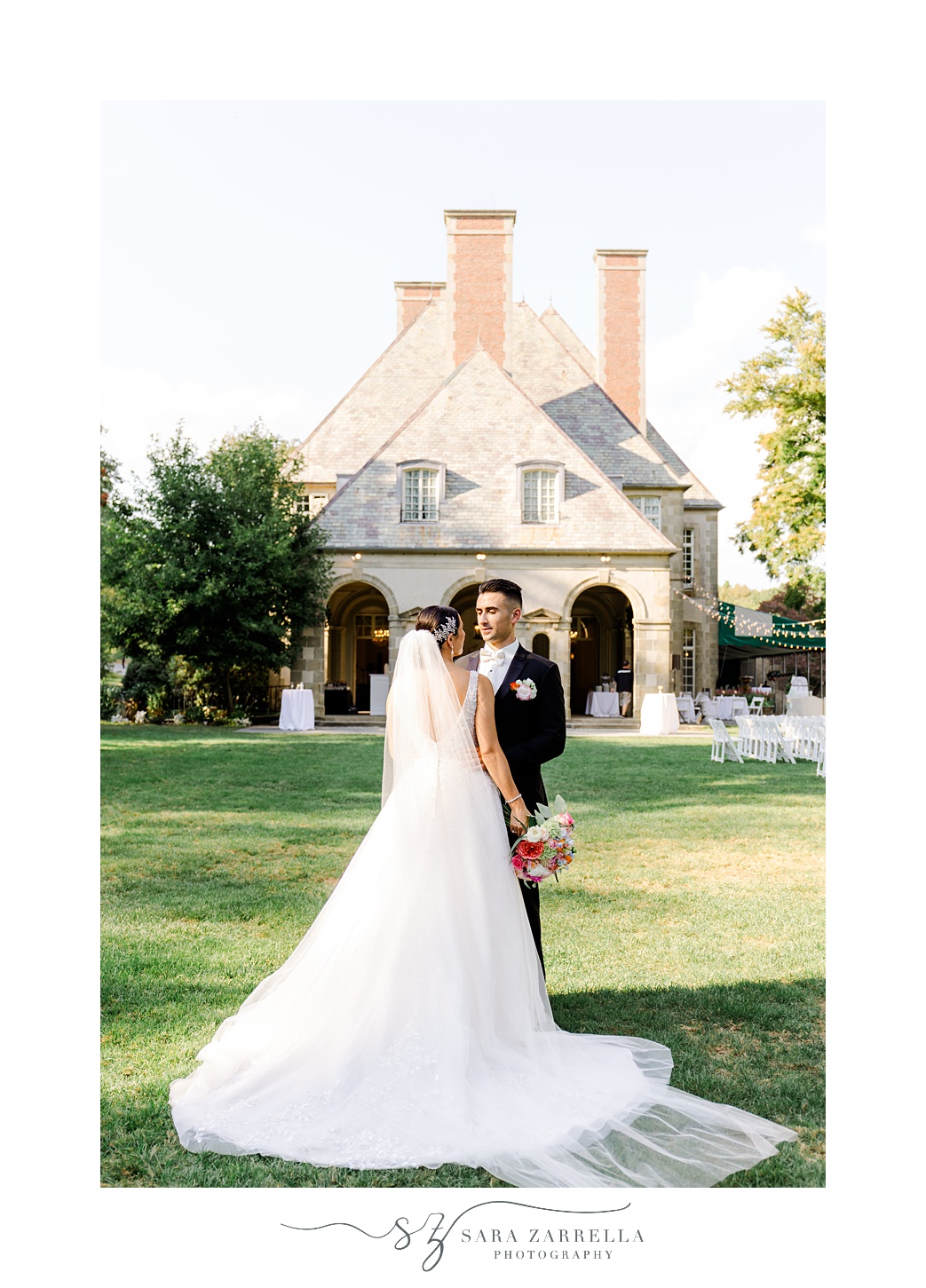 bride and groom hold hands in front of patio of Glen Manor House