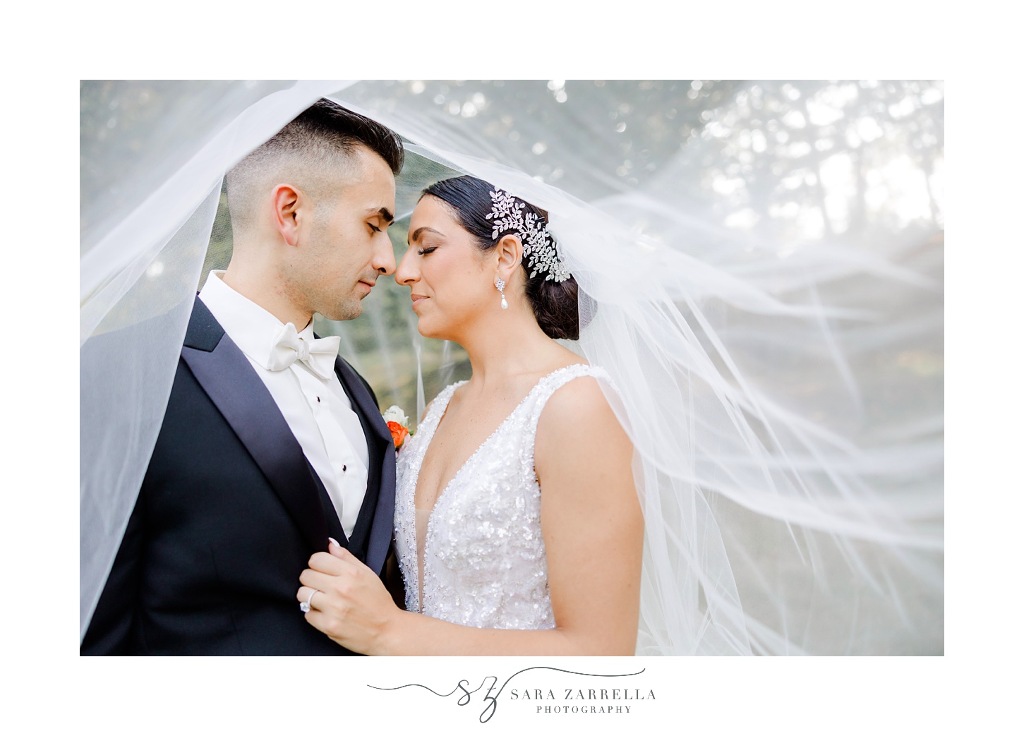bride and groom look at each other under the veil