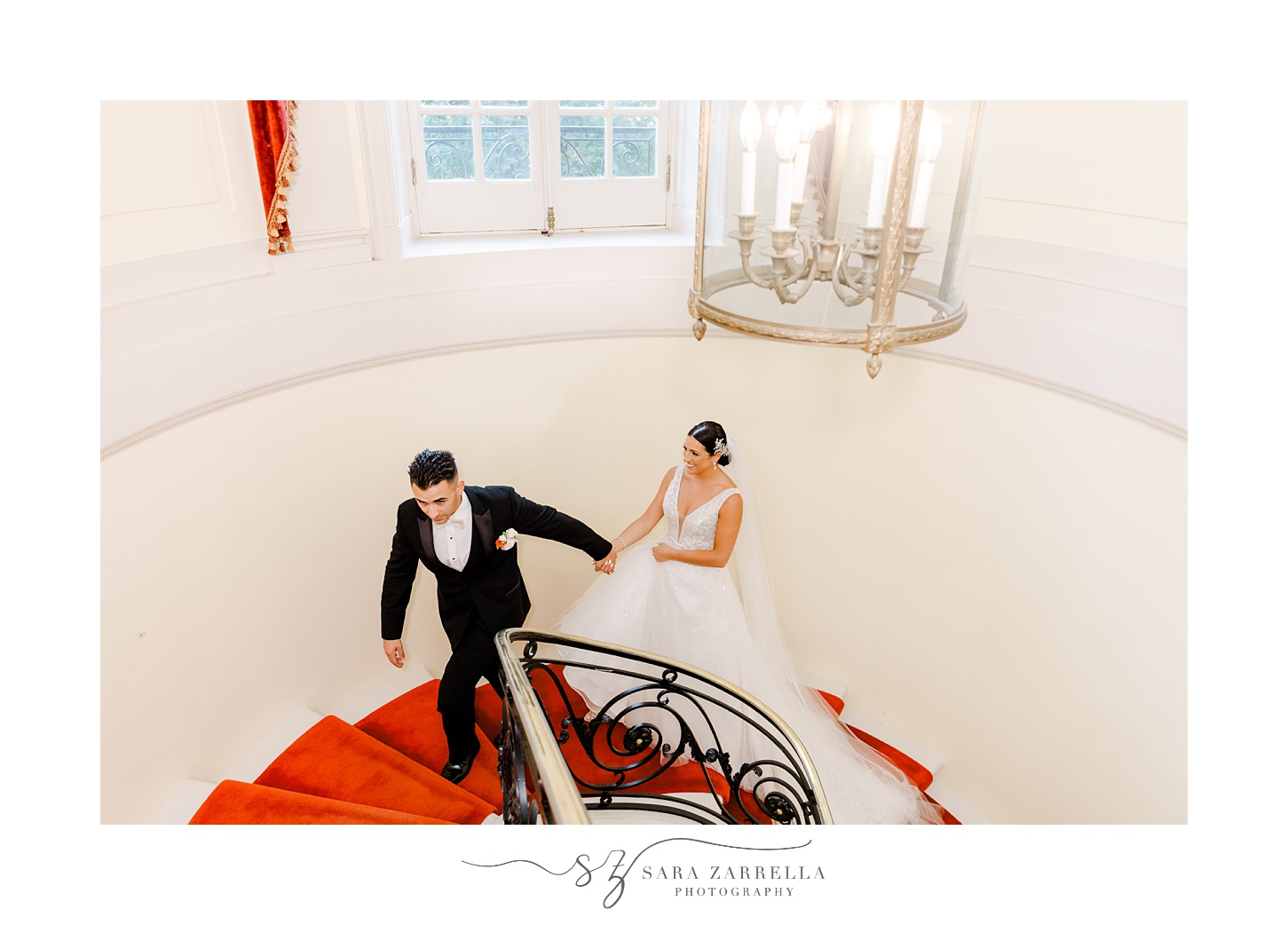 groom leads bride through carpet covered staircase inside Glen Manor House