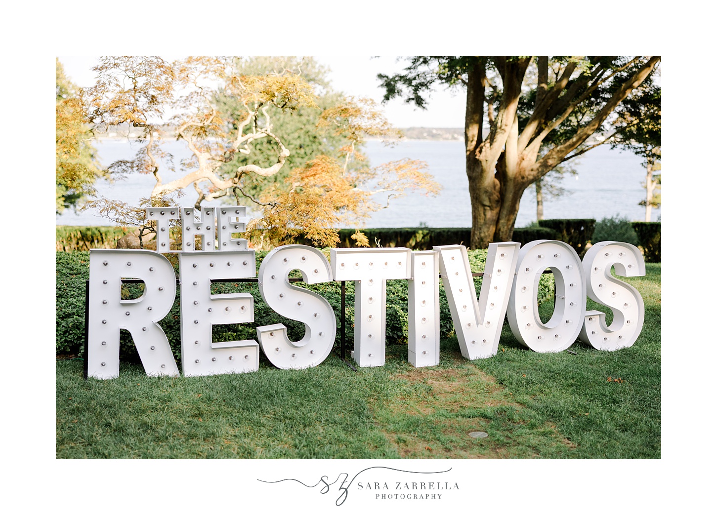 white block letters with lights in couple's name