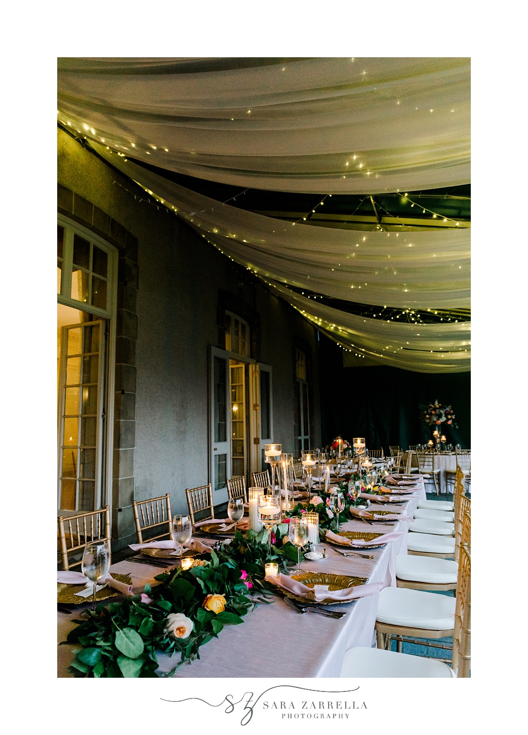 glowing lights above tables for English garden inspired wedding reception