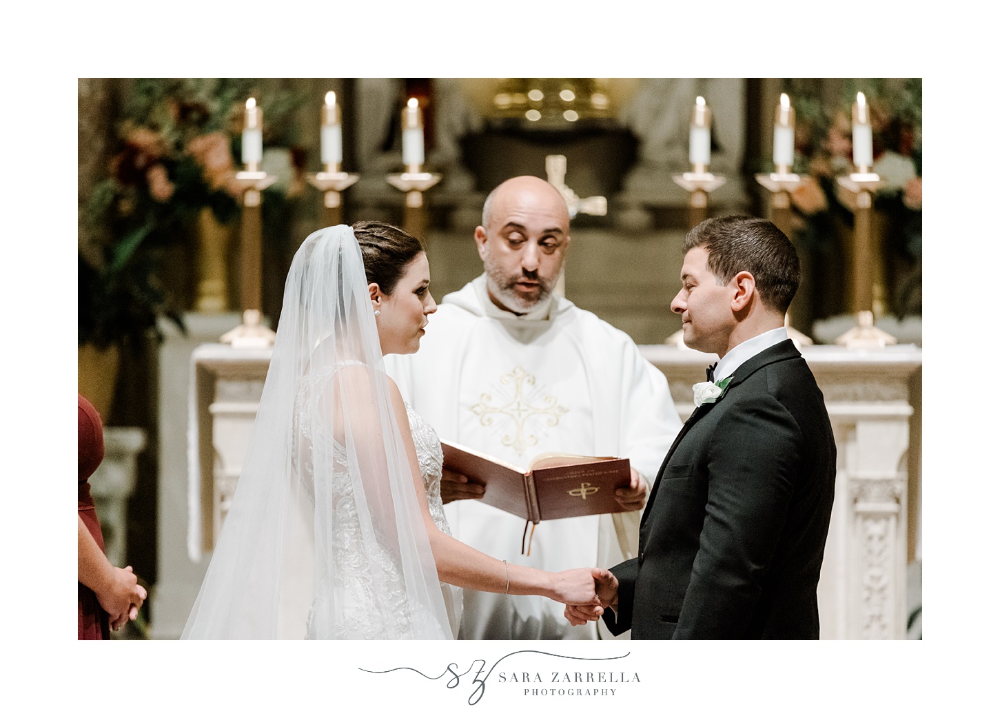 bride and groom exchange vows in front of officiant at the Holy Ghost Church