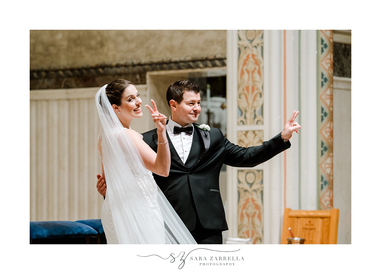 bride and groom wave to wedding guests inside the Holy Ghost Church