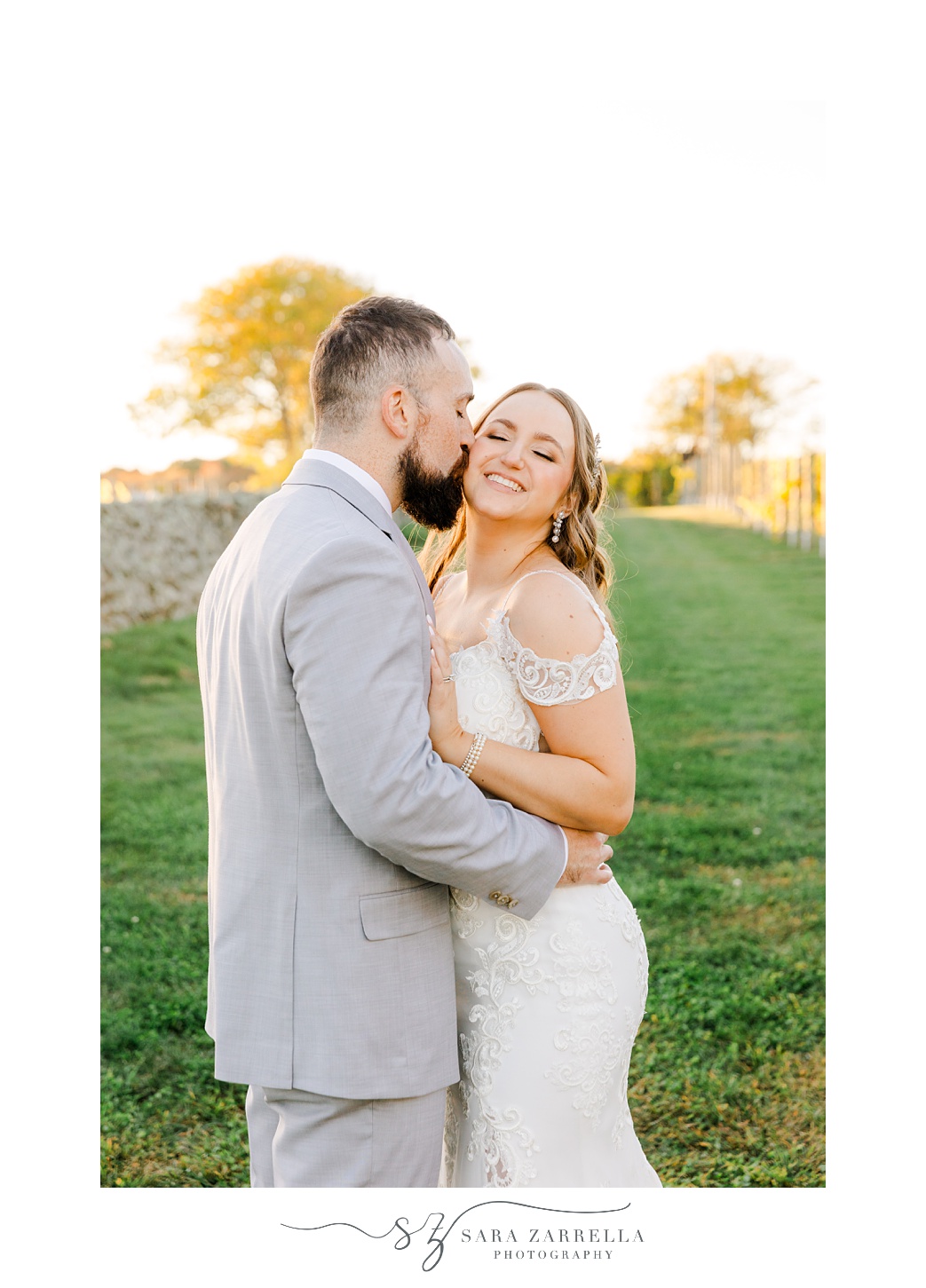 groom kisses bride's cheek during portraits vineyard at Shepard's Run