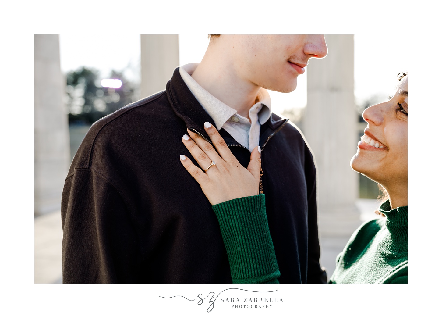 woman holds hand on man's chest during proposal in Roger Williams Park