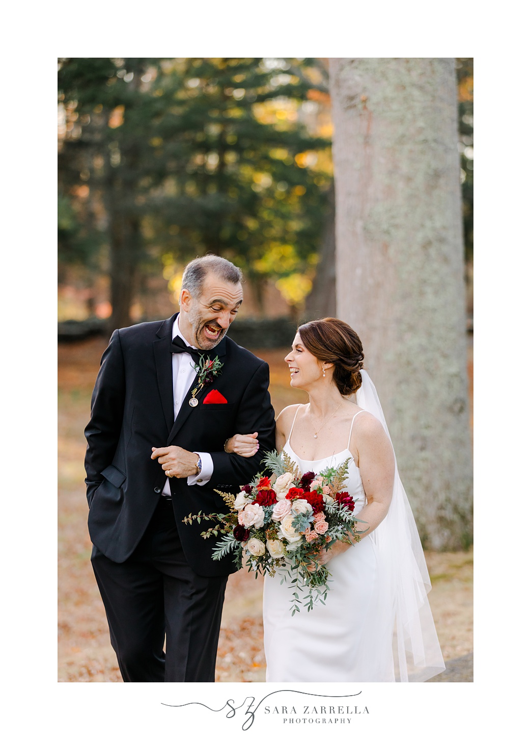 bride and groom walk together outside Quidnessett Country Club