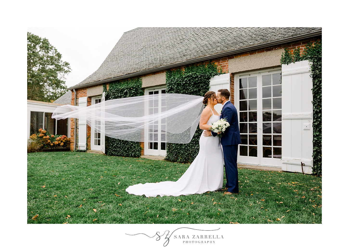 bride and groom kiss with veil floating outside Shepard's Run