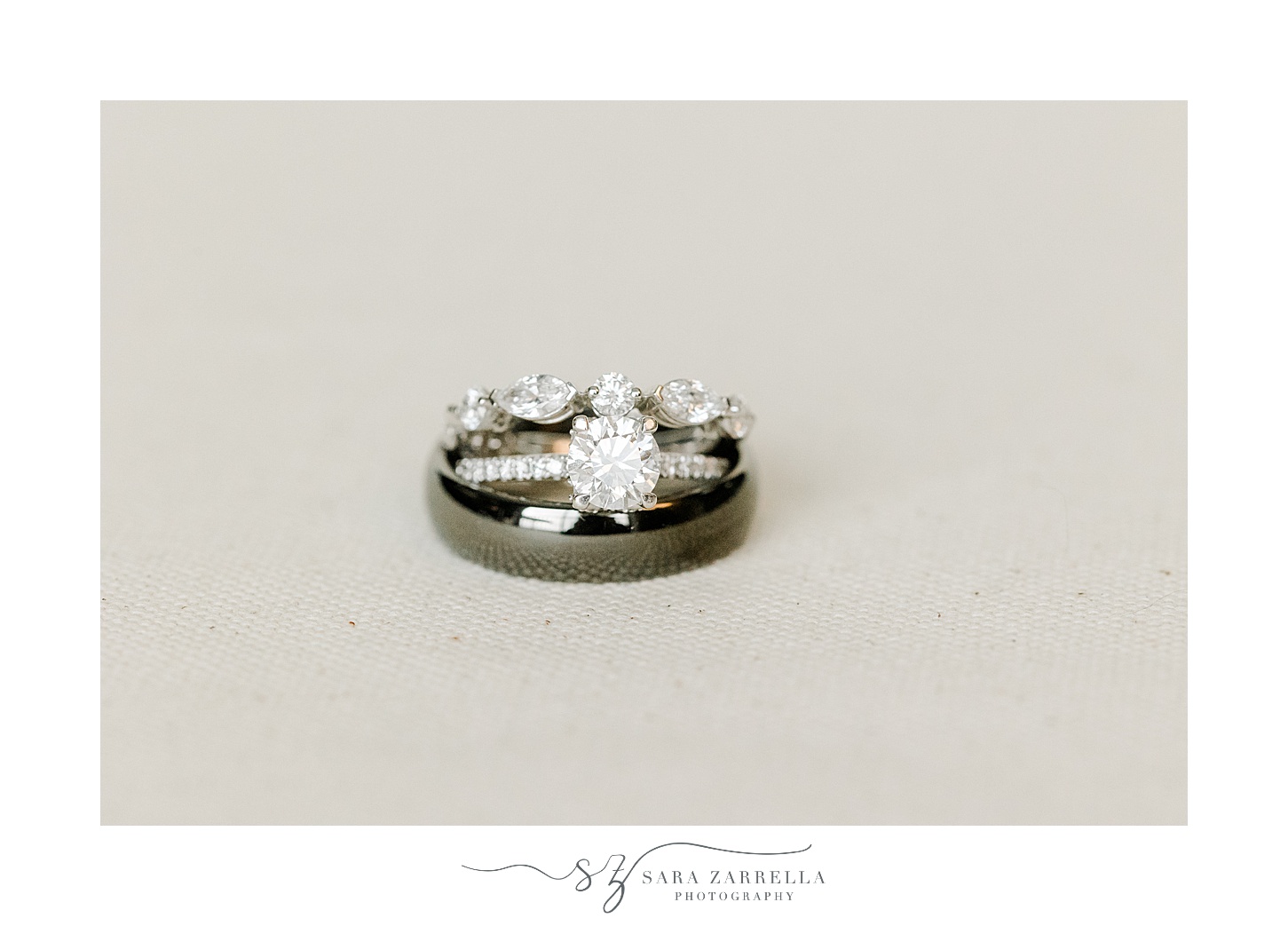 diamond ring and man's wedding band stacked together