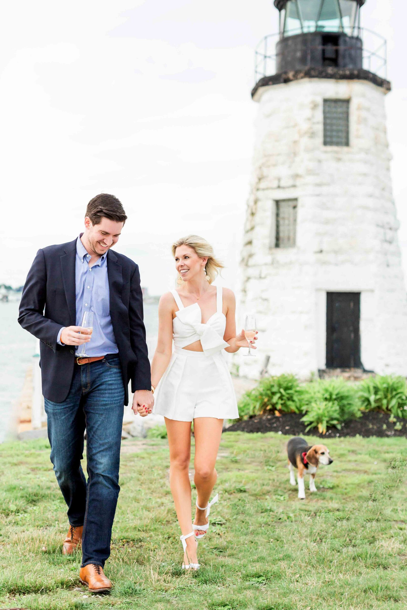 Newly Engaged Couple Walking on Lawn Near Lighthouse at Newport Harbor Island
